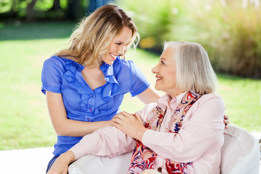Affectionate Granddaughter And Grandmother At Nursing Home Porch EHPAD Evreux : un accompagnement doux et chaleureux